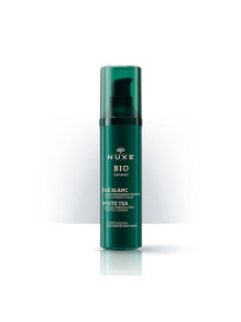 Nuxe bio tonirana vlažilna krema za kožo srednjega odtenka v zeleni valjkasti embalaži.